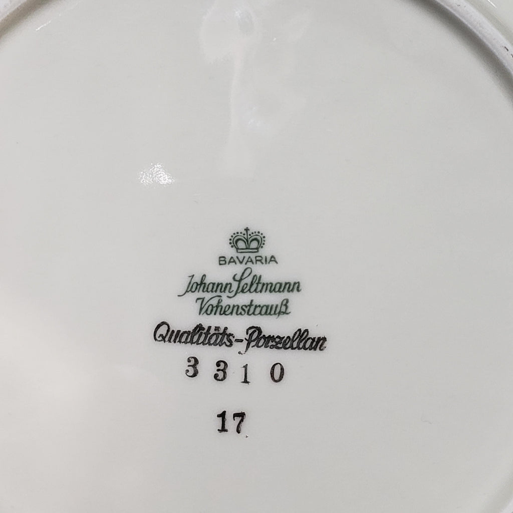 a close-up view of a white porcelain plate with text and numbers printed on it.