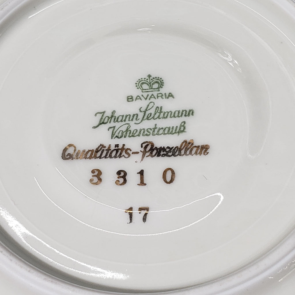 a close-up view of a porcelain plate with text and numbers engraved on it.
