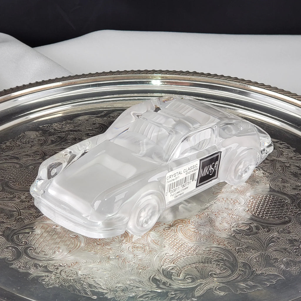 Vintage Mikasa crystal classic car figurine on an ornate silver tray.