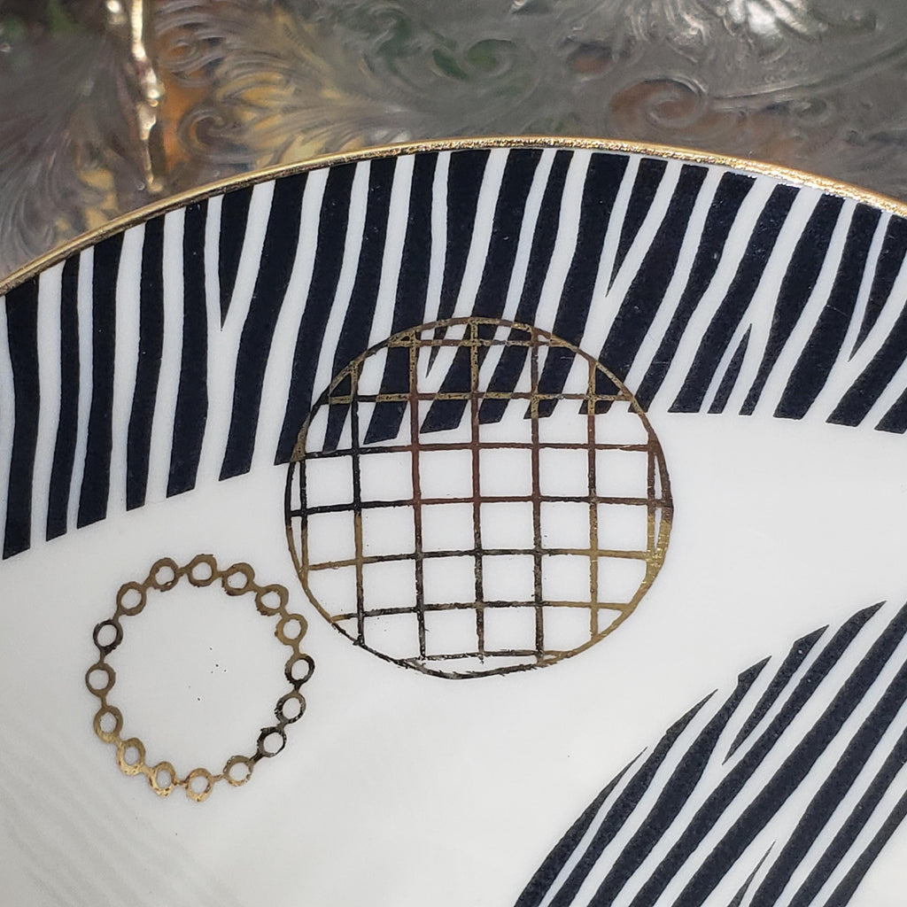 a close-up view of a decorative plate with a zebra print design and a circular pattern.